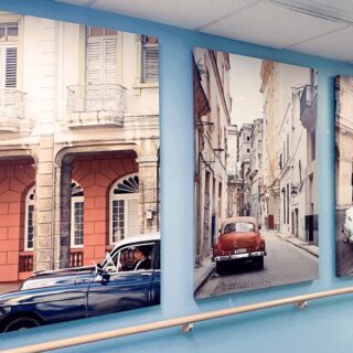 photos of old cars parked along a European street