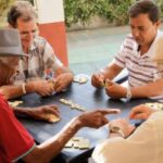 Active Retirement Happy Old Friends Playing Domino Game