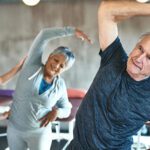 seniors stretching with instructor